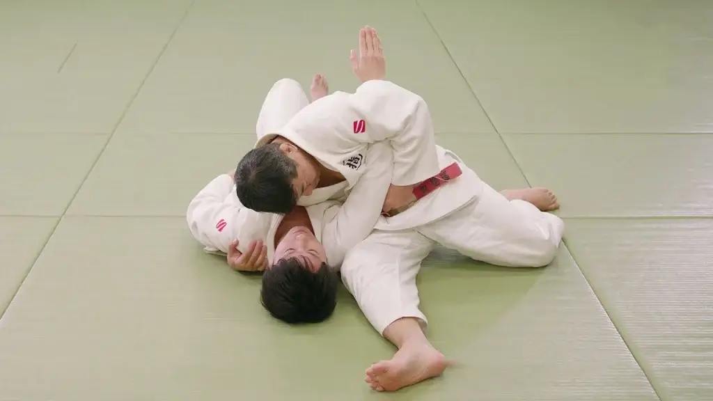 Judoka in Kuzure-kesa-gatame Position.